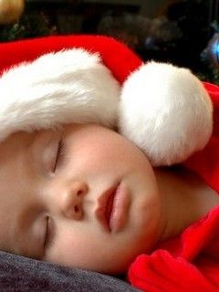 Bambino che Dorme con Cappello di Babbo Natale - wallpaper preview